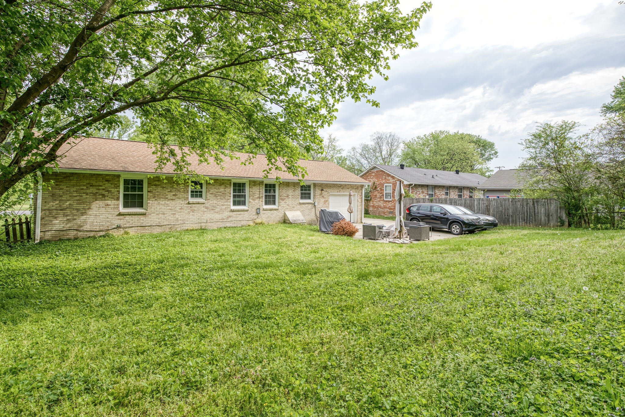 45 Benzing Road Antioch, TN 37013 - Photo 24 of 25 a front view of a house with a yard table and chairs