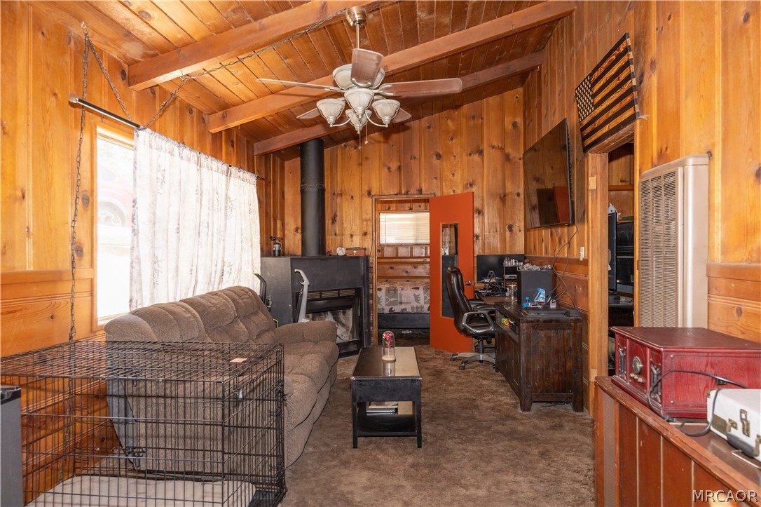 2485 Spring Drive Running Springs, CA 92382 - Photo 3 of 10 a living room with furniture a large window and chandelier