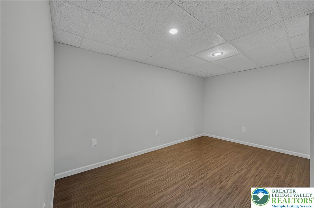 4236 Creek Road Allentown, PA 18104 - Photo 35 of 47 Smooth wood-grain flooring and integrated overhead lighting define this versatile finished lower-level space.