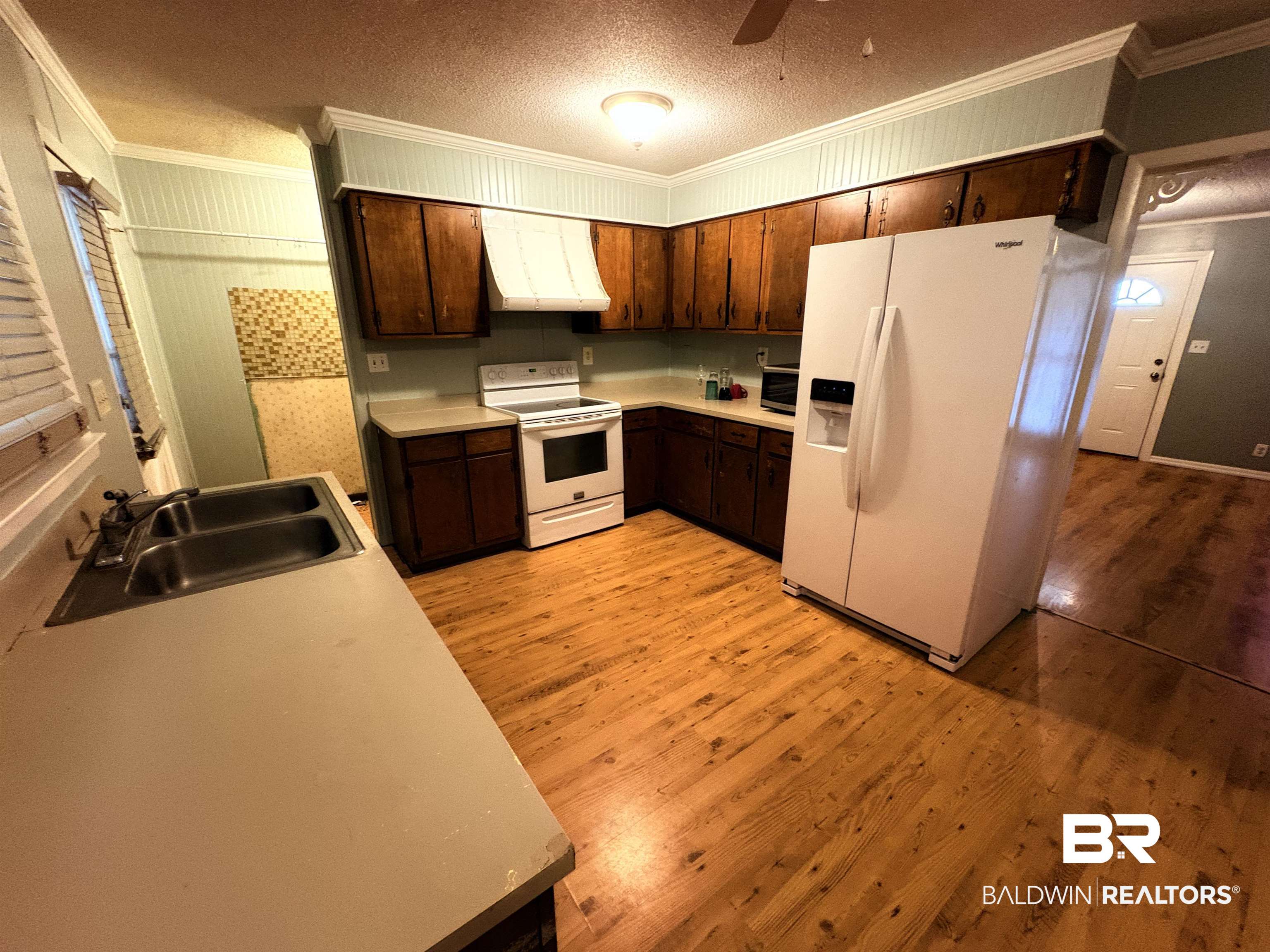 8065 Middle Ring Road Mobile, AL 36619 - Photo 5 of 21 Kitchen with light wood-style flooring, white appliances, ventilation hood, and a sink