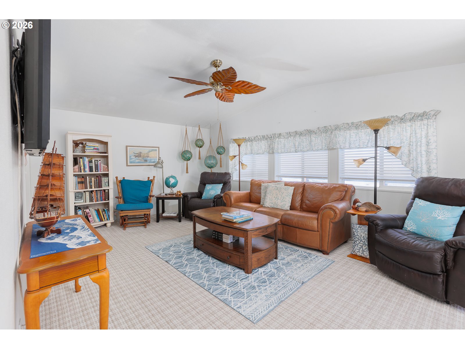 2018 Northwest Oceanic Loop Waldport, OR 97394 - Photo 13 of 35 a living room with furniture and a flat screen tv