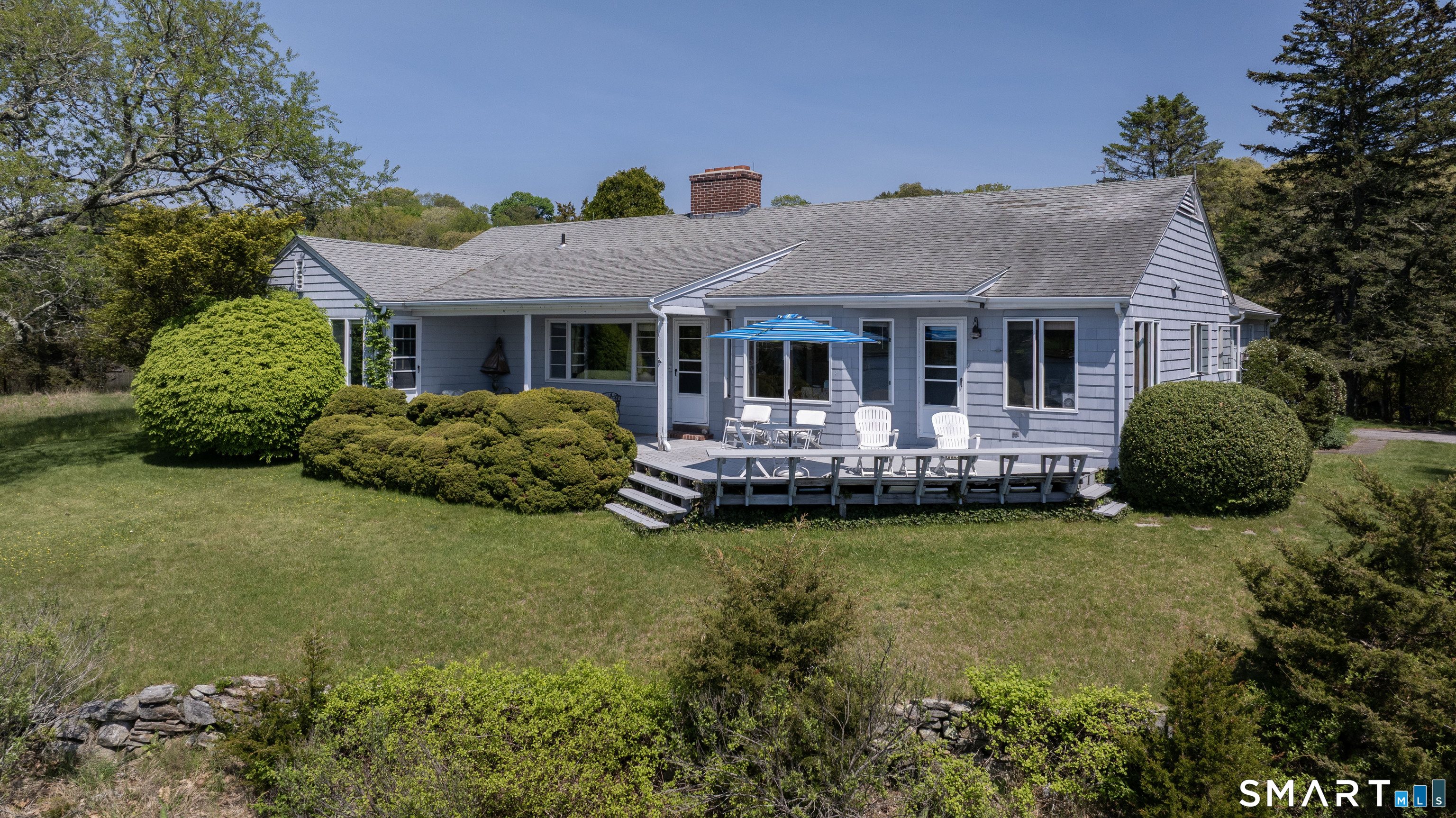 27 Wilbur Road Stonington, CT 06378 - Photo 31 of 40 a front view of a house with garden