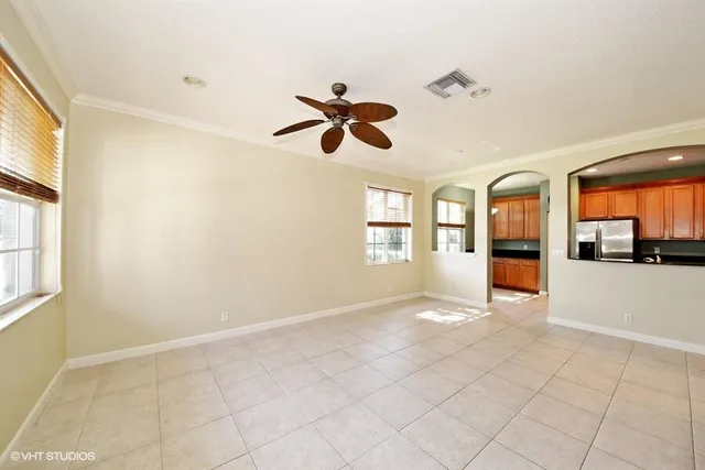 a view of an empty room with windows