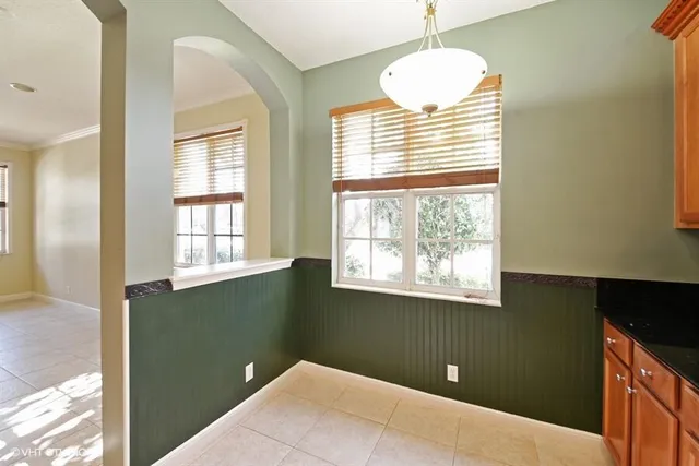 a kitchen with a refrigerator and a sink