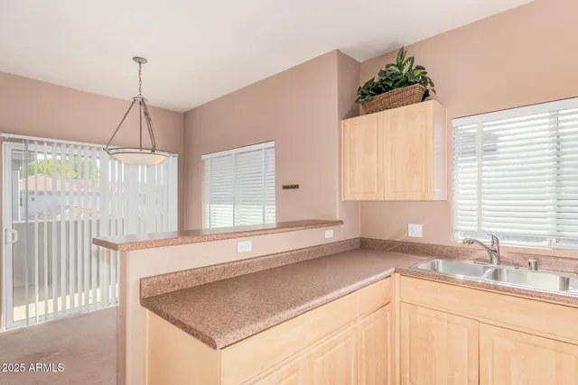a kitchen with a sink and a window