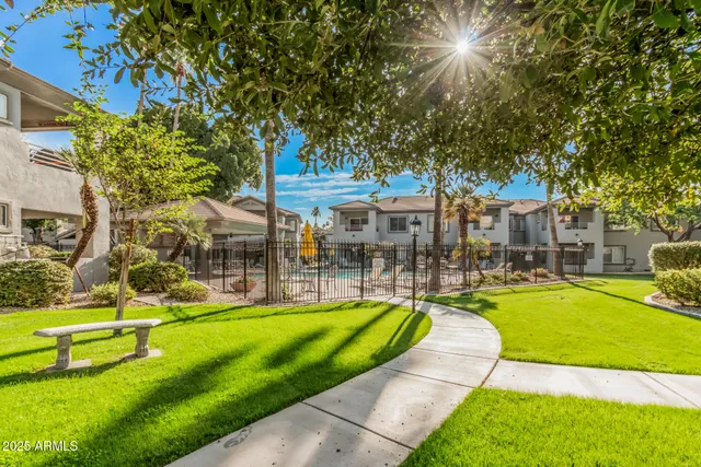 a view of a house with swimming pool and a big yard