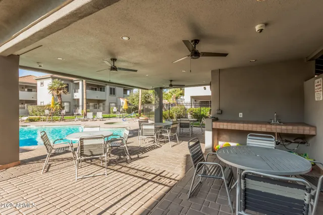 a living room with a table a table and chairs
