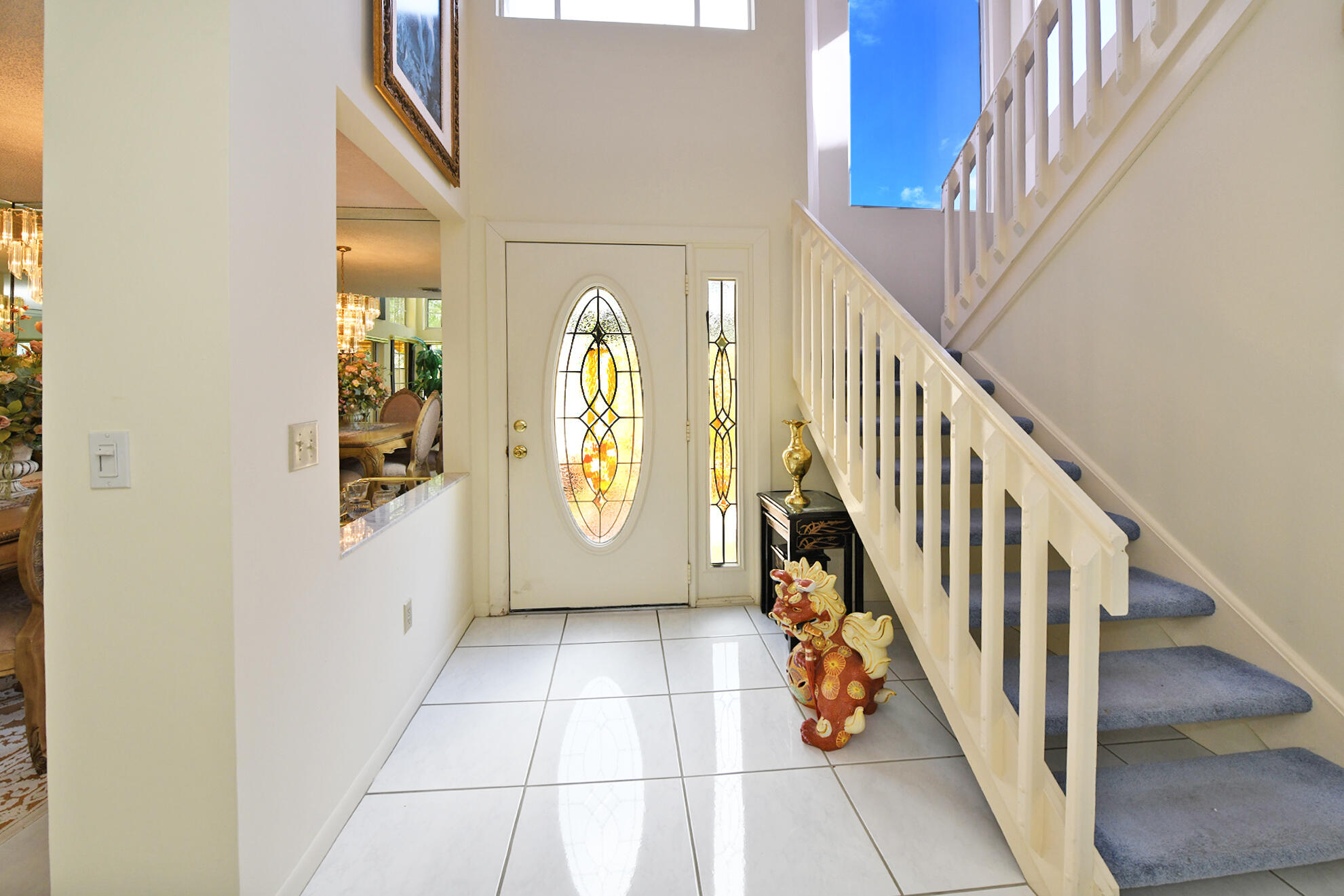 5135 Pointe Alexis Boca Raton, FL 33431 - Photo 17 of 35 a view of an entryway with wooden floor and windows
