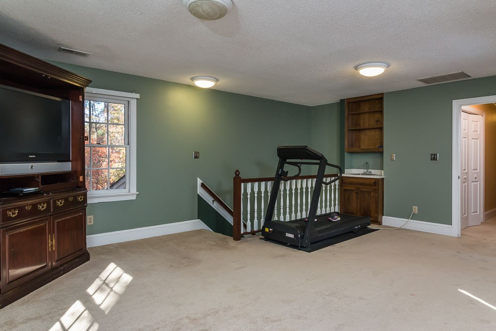 704 Downpatrick Lane Raleigh, NC 27615 - Photo 21 of 25 Bonus room /Wet Bar