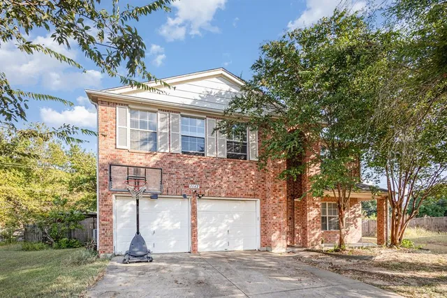 front view of a house with a trees