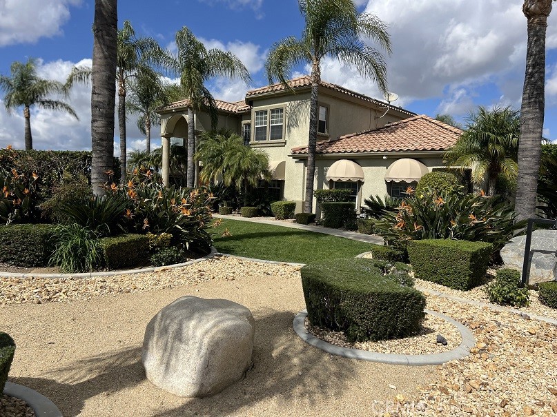 16130 Reiner Circle Riverside, CA 92504 - Photo 11 of 74 a view of a white house with a yard and plants