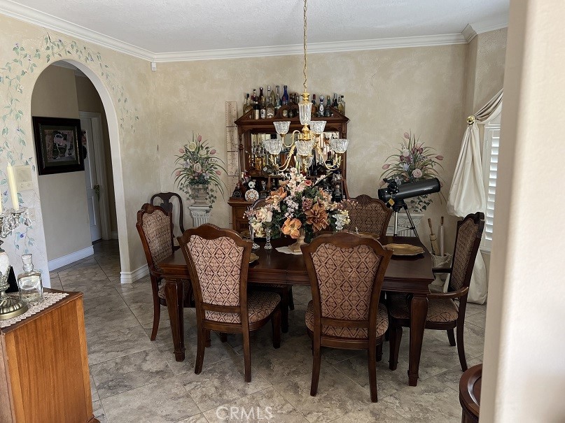 16130 Reiner Circle Riverside, CA 92504 - Photo 15 of 74 a view of a dining room with furniture and chandelier