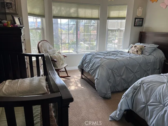 a view of a bathroom with shower and a bathtub