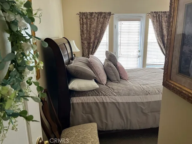 a bathroom with a tub and potted plant