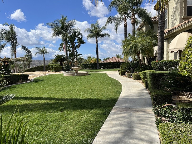 16130 Reiner Circle Riverside, CA 92504 - Photo 4 of 74 a view of a swimming pool with a garden