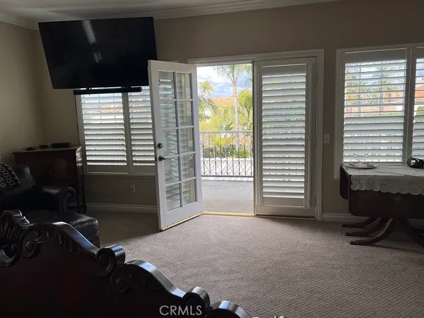 a view of a house with backyard porch and sitting area