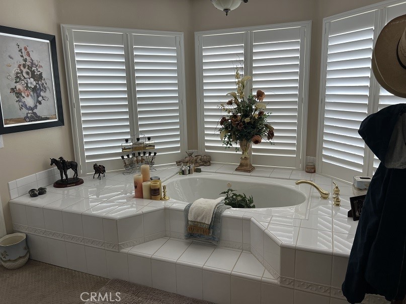 16130 Reiner Circle Riverside, CA 92504 - Photo 46 of 74 a bathroom with a bathtub and sink