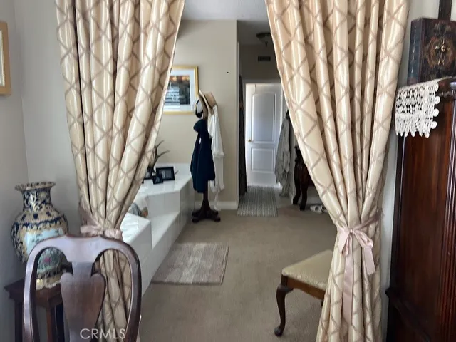 a view of a white house with a yard