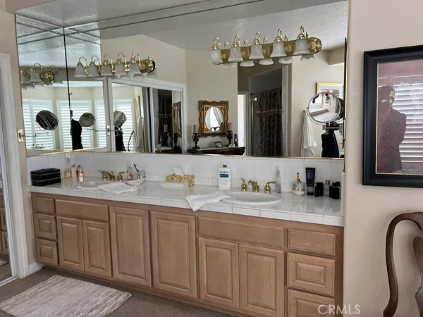 a kitchen with a refrigerator and a sink