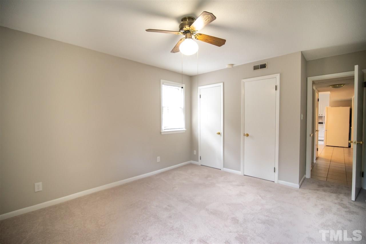 1413 Kennon Road Garner, NC 27529 - Photo 14 of 25 Spacious bedroom conveniently located on the first floor. Could double as an office too!