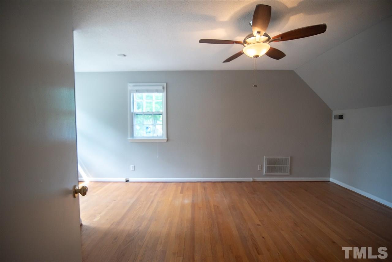 1413 Kennon Road Garner, NC 27529 - Photo 20 of 25 Spacious room for kids or guests. Relaxed with a family friendly feel!