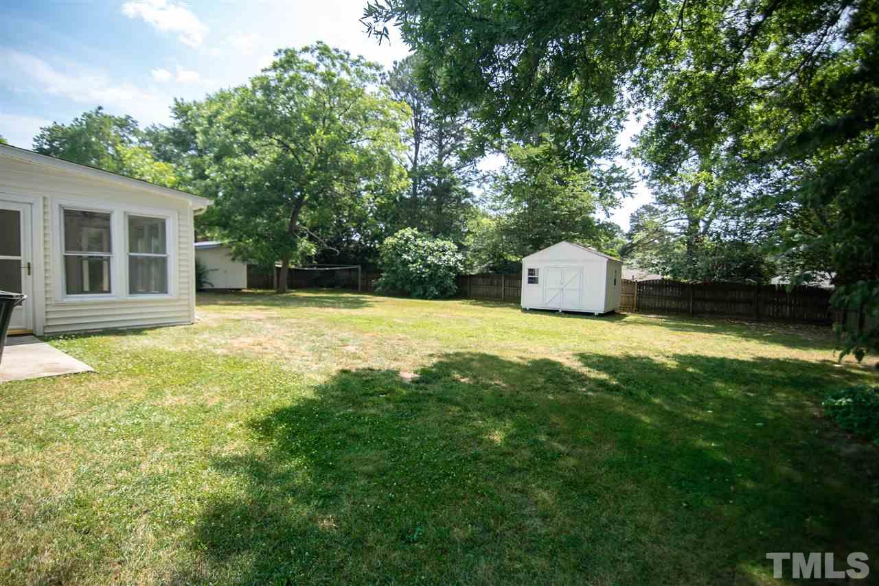 1413 Kennon Road Garner, NC 27529 - Photo 21 of 25 Keep all your tools and more in the large storage shed.