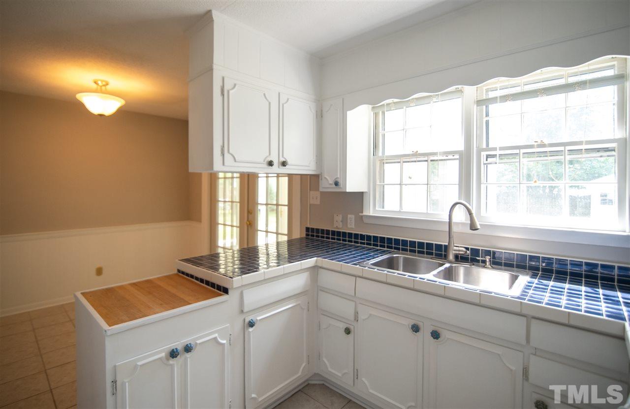 Enjoy preparing meals as the Carolina sun shines through the expansive window.