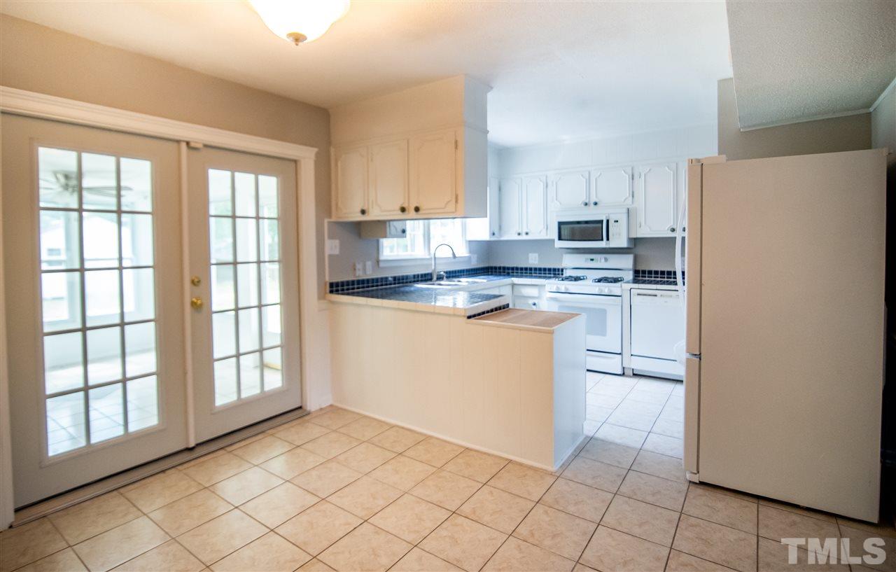 1413 Kennon Road Garner, NC 27529 - Photo 8 of 25 Space features large windows perfect for enjoying family meals.