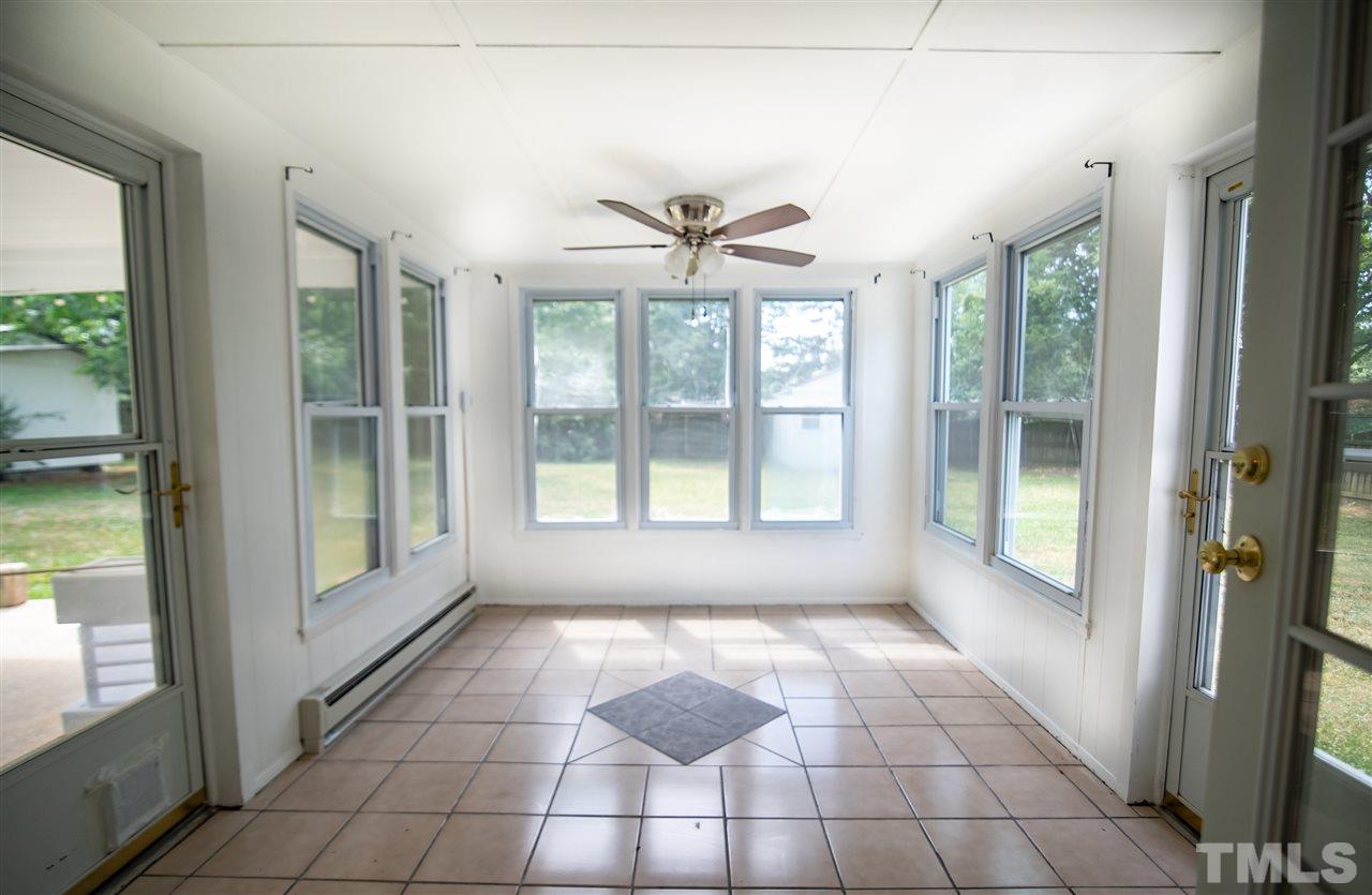 1413 Kennon Road Garner, NC 27529 - Photo 9 of 25 French doors welcome you into this 4 season, delightful sunroom. Light and bright!