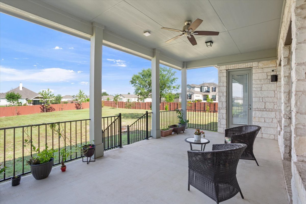 3625 Garrano Bend Leander, TX 78641 - Photo 29 of 38 A spacious covered patio offers ample room for relaxation and entertaining, overlooking a well-maintained private yard.