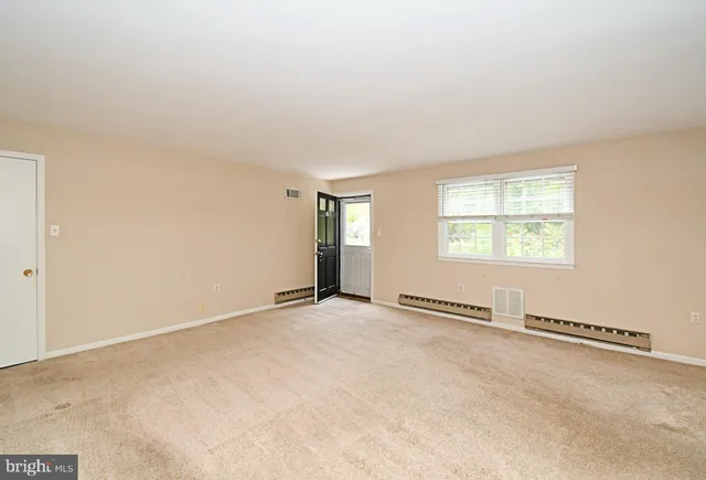 a view of a kitchen with a sink and a stove top oven