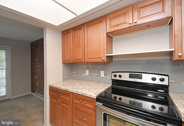 a kitchen with a stove and a microwave
