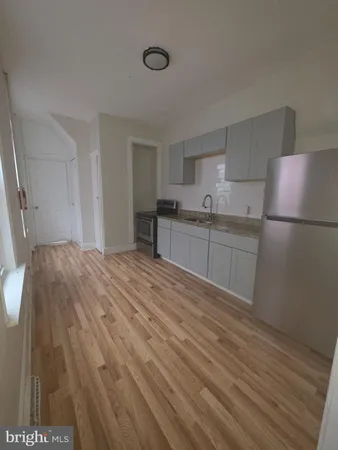a room with a bed and a cabinets