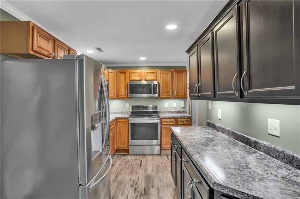143 Northview Circle Beaver, PA 15009 - Photo 11 of 41 a kitchen with stainless steel appliances granite countertop a refrigerator a stove top oven a sink and dishwasher