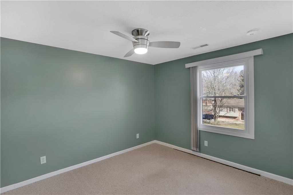143 Northview Circle Beaver, PA 15009 - Photo 17 of 41 an empty room with a window and ceiling fan