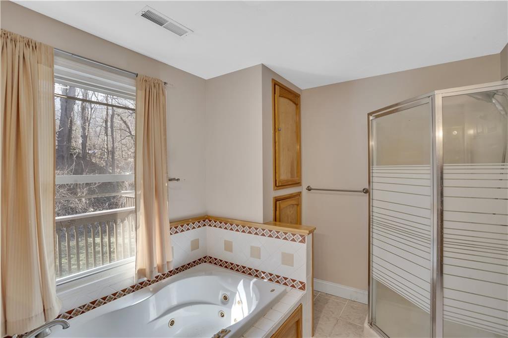 143 Northview Circle Beaver, PA 15009 - Photo 19 of 41 a bathroom with a tub and a shower