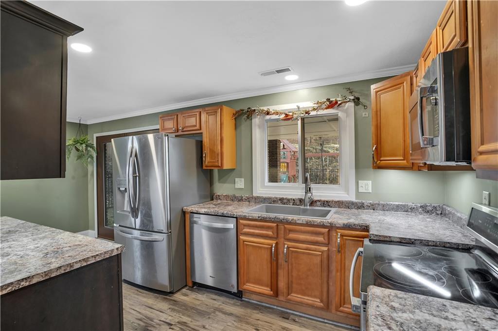 143 Northview Circle Beaver, PA 15009 - Photo 9 of 41 a kitchen with stainless steel appliances granite countertop a sink stove and refrigerator