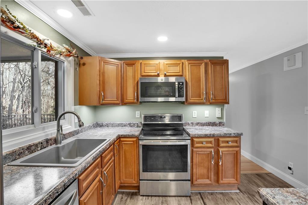 143 Northview Circle Beaver, PA 15009 - Photo 10 of 41 a kitchen with granite countertop a sink cabinets and stainless steel appliances
