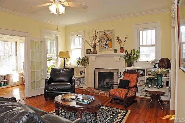 1707 Dare Street Raleigh, NC 27608 - Photo 4 of 12 French doors lead you into the cheerful sunroom from the living area