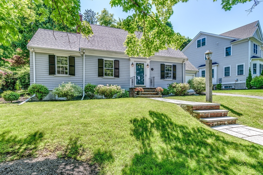 56 Radcliffe Road Belmont, MA 02478 - Photo 1 of 41 a front view of a house with a yard and trees