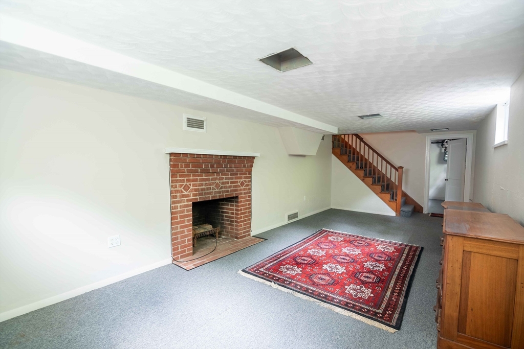 56 Radcliffe Road Belmont, MA 02478 - Photo 29 of 41 a view of an empty room and fire place