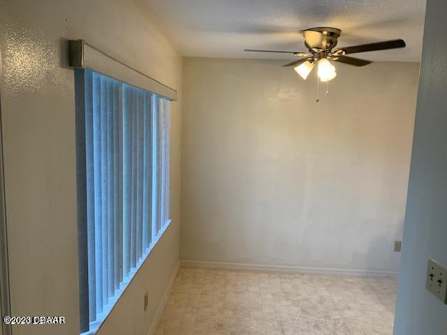 1601 Big Tree Road, Unit 108 Daytona Beach, FL 32119 - Photo 12 of 17 a view of a hallway with a ceiling fan