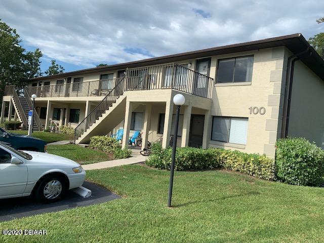 1601 Big Tree Road, Unit 108 Daytona Beach, FL 32119 - Photo 3 of 17 a house view with a garden space