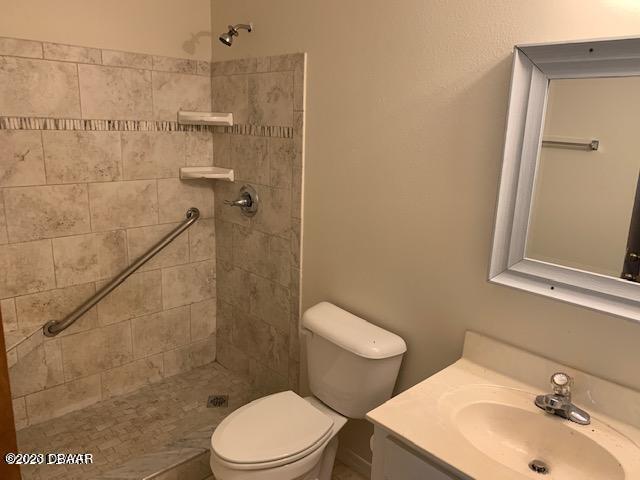 1601 Big Tree Road, Unit 108 Daytona Beach, FL 32119 - Photo 8 of 17 a bathroom with a sink a toilet and shower
