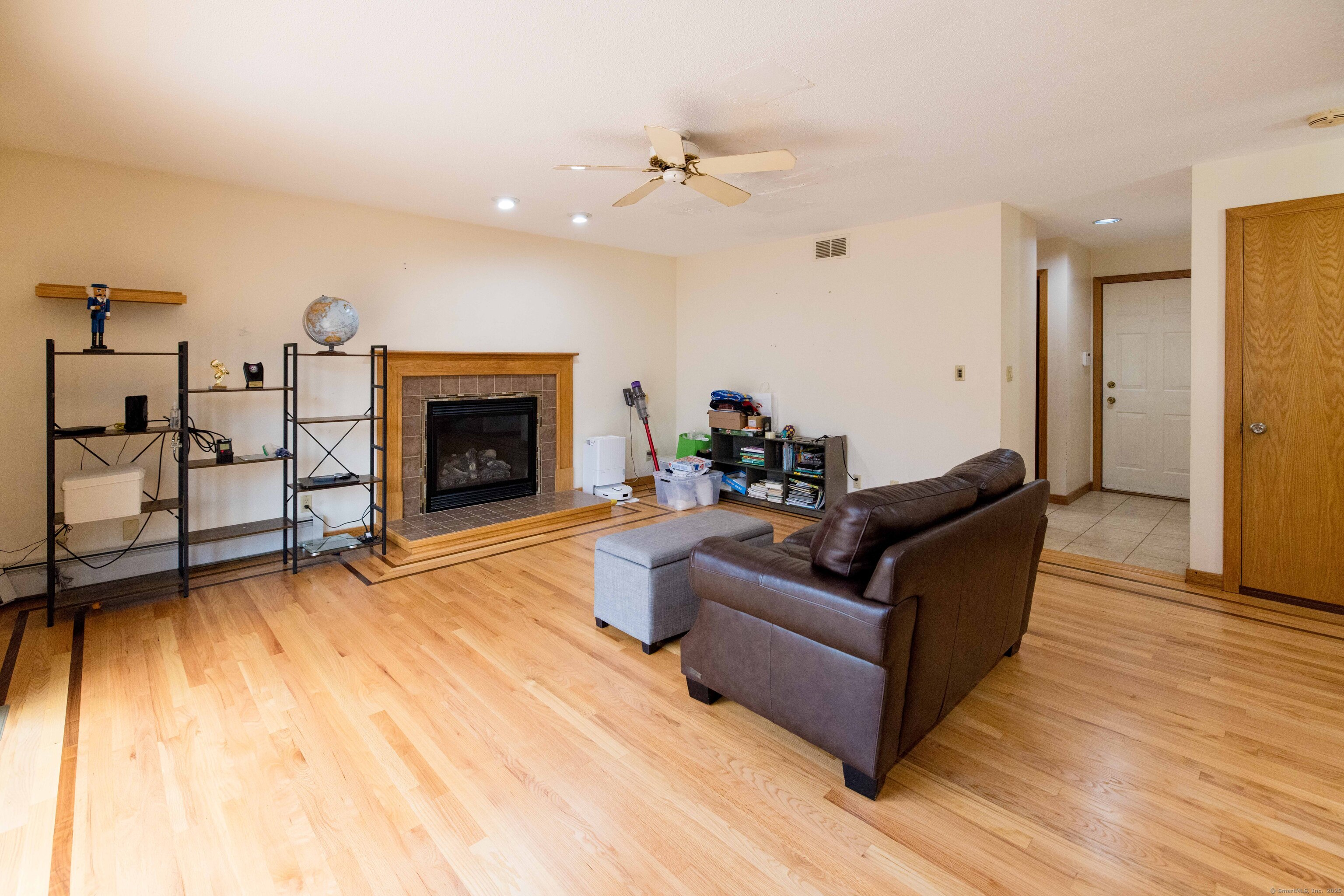 18 Clifford Avenue Tolland, CT 06084 - Photo 14 of 40 a living room with furniture and a fireplace