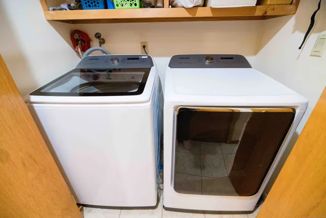 a utility room with washer and dryer