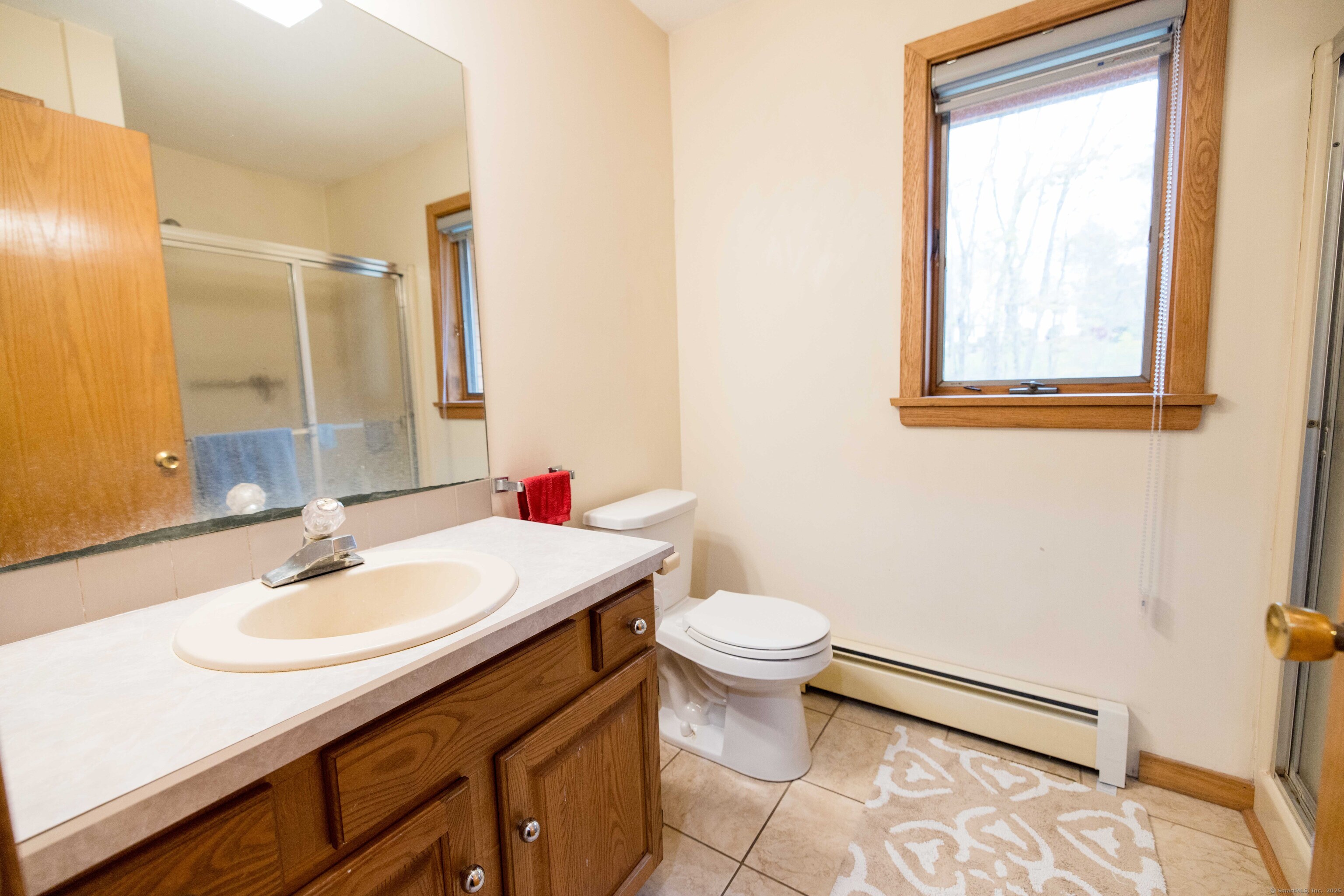 18 Clifford Avenue Tolland, CT 06084 - Photo 16 of 40 a bathroom with a sink toilet and mirror