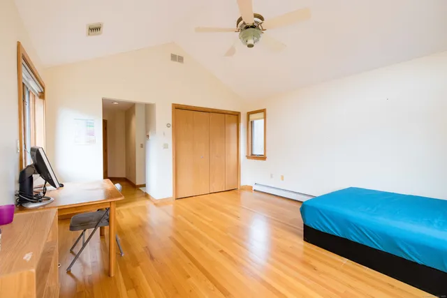 a view of a room with wooden floor