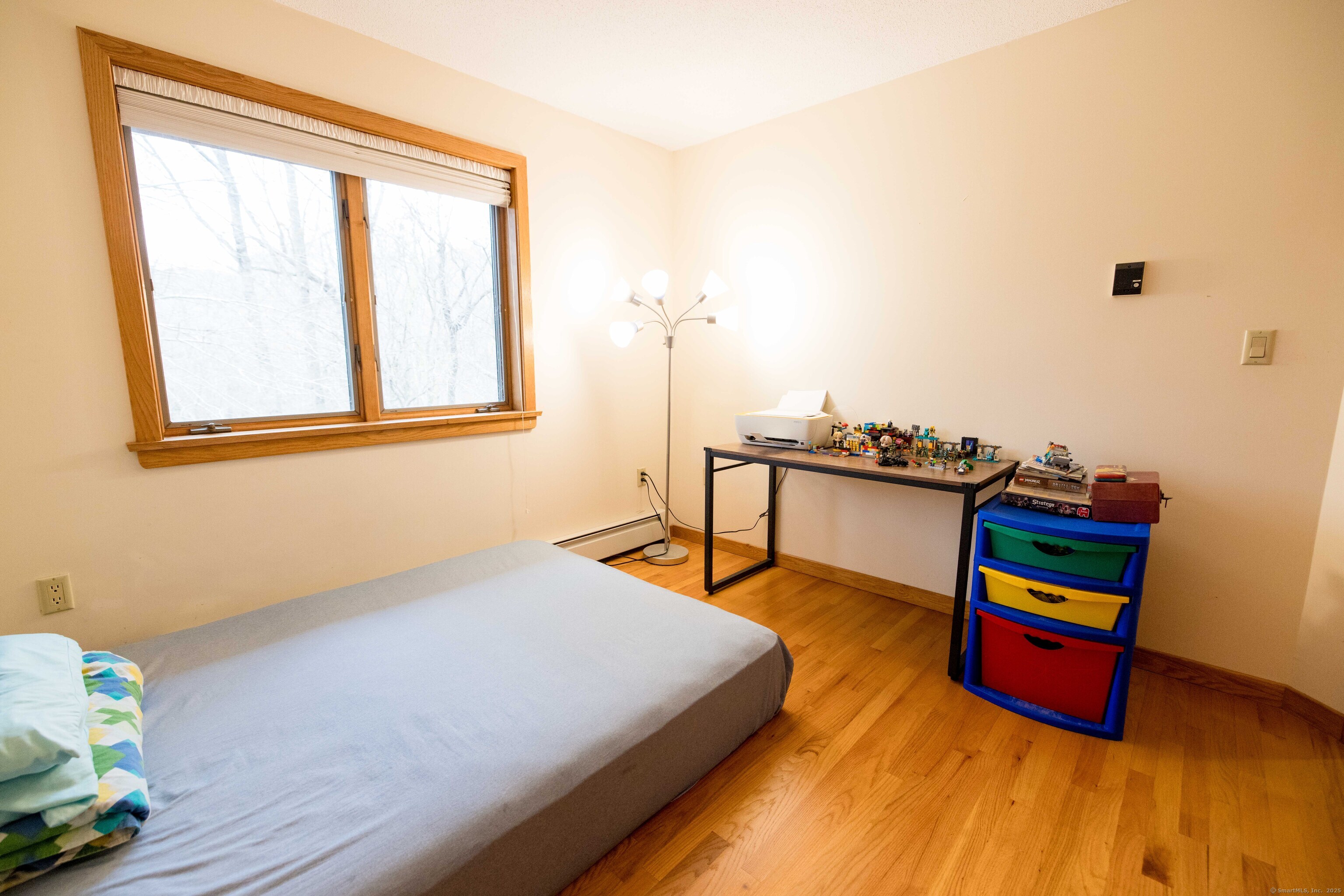 18 Clifford Avenue Tolland, CT 06084 - Photo 24 of 40 a bedroom with a bed and wooden floor