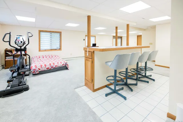 a dining room with furniture and window